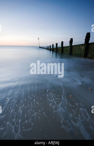 Water rising up the beach in glorious pre-dawn light on Hayling Island, Hampshire. Stock Photo