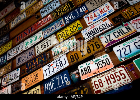 Old American license and number plates pictured covering the roof of a bar in Pasadena, California, USA. Stock Photo