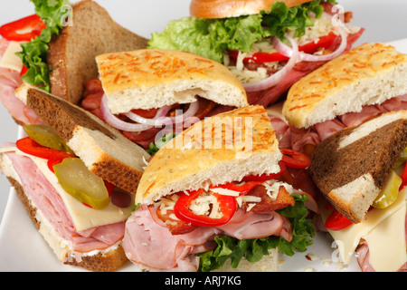 A platter of Foccacia bread sandwiches with vegetables on a dining table from above overhead close up nobody in USA US horizontal hi-res Stock Photo