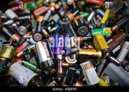 Used disposable batteries for recycling at a recycling centre, UK Stock Photo