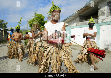 Penitent Filipinos flagellate themselves with bamboo whips on Good Friday in Mansalay, Oriental Mindoro, Philippines. Stock Photo