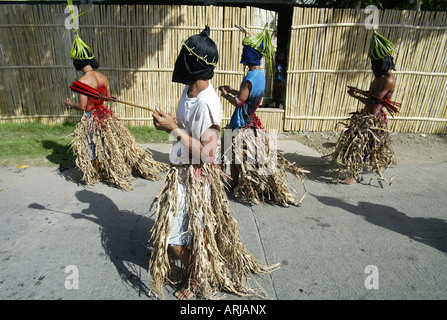 Penitent Filipinos flagellate themselves with bamboo whips on Good Friday in Mansalay, Oriental Mindoro, Philippines. Stock Photo