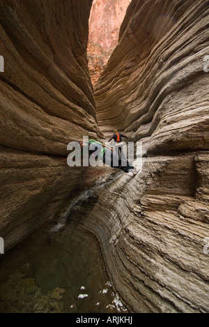 Having fun while hiking Matkatamiba Canyon a side canyon on the Colorado River in the Grand Canyon National Park Arizona Stock Photo