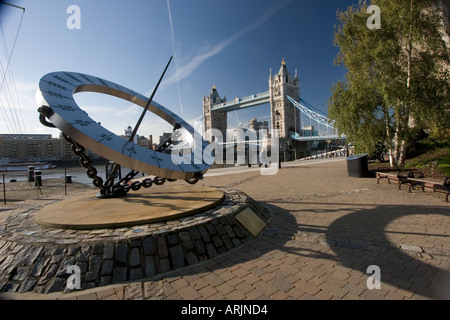 Sundial and Tower Bridge from St Katherine s Dock London England UK Stock Photo