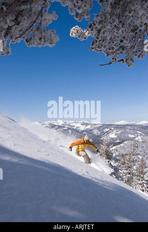 Side profile of a woman skiing on snow, Lake Tahoe, California, USA Stock Photo