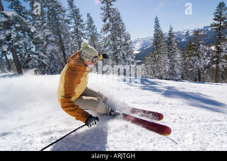 Side profile of a woman skiing on snow, Lake Tahoe, California, USA Stock Photo