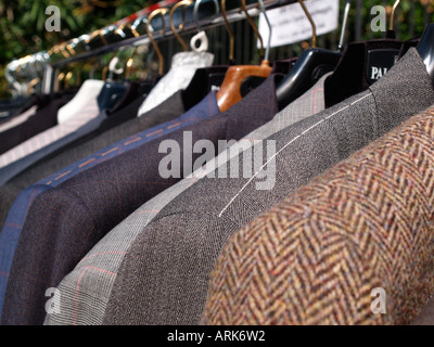 men jackets hanging on coat rail Stock Photo