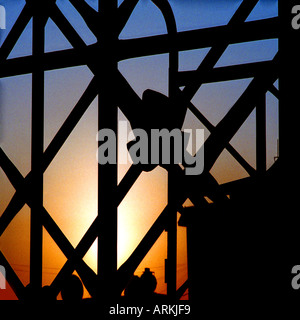 sunset through the abstract shape of a truck in Dubai Stock Photo