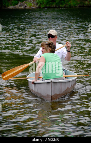 Canoeing on the Au Sable River at the Rifle River Recreational Area near Mio Michigan MI husband wife teamwork couple Stock Photo