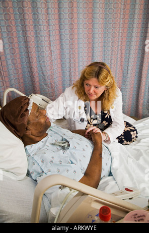 Nurse with Patient in End of Life Care Program Stock Photo