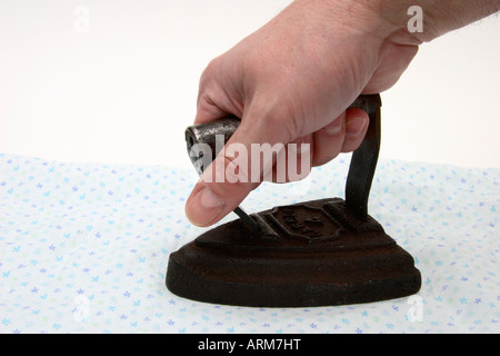 An old Victorian antique domestic smoothing iron. Stock Photo