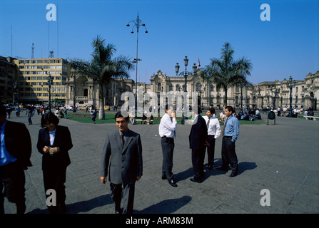 Business people talking on the Plaza de Armas, Lima, Peru, South America Stock Photo