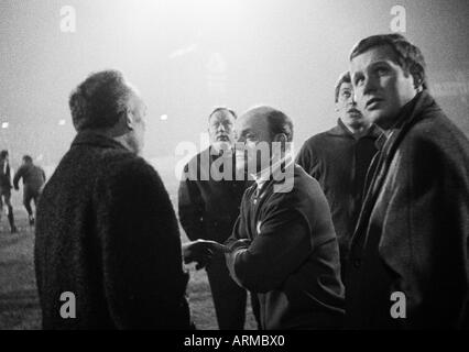 football, Regionalliga West, 1968/1969, Eintracht Gelsenkirchen versus Rot-Weiss Oberhausen 0:2, Stadium Glueckaufkampfbahn in Gelsenkirchen, time-out caused by breakdown of the floodlights, waiting for the match continuation, in the middle coach Alfred A Stock Photo