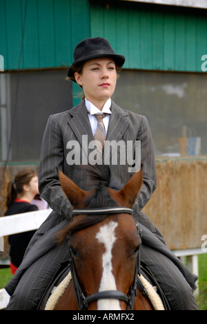 High school female student competes in equestrian event Stock Photo