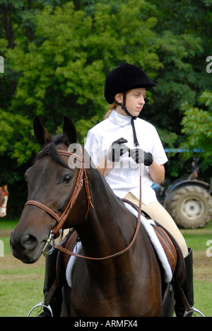 High school female student competes in equestrian event Stock Photo