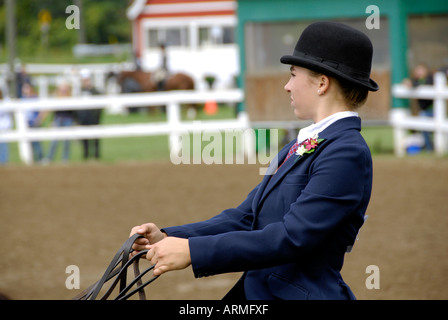 High school female student competes in equestrian event Stock Photo