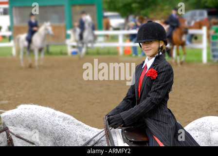 High school female student competes in equestrian event Stock Photo