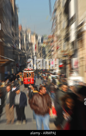 ISTANBUL, TURKEY. Shopping thoroughfare of Istiklal Caddesi in Beyoglu district, with Tunel-Taksim tram approaching. 2007. Stock Photo