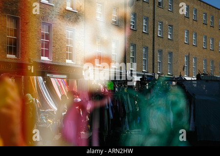 Church Street Market reflected in the window of Alfies Antiques in Lisson Grove, London Stock Photo
