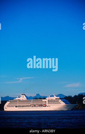 Passenger cruise ship in Johnstone Stait, near Campbell River, Quadra Island behind, British Columbia, Canada. Stock Photo