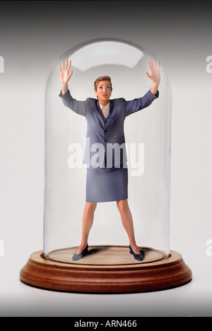 businesswoman trapped in glass bell jar Stock Photo