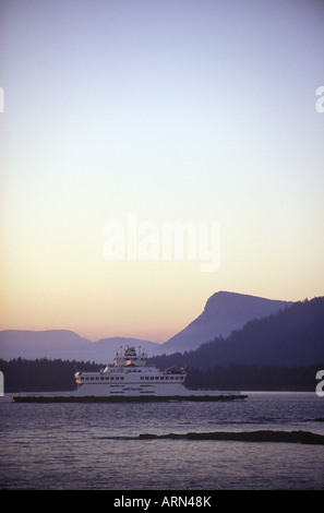 BC Ferry enroute to Fulford Harbour, Saltspring Island from Swartz Bay, near Victoria at twilight, British Columbia, Canada. Stock Photo