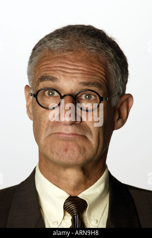 Faces Businessman looking skeptical Stock Photo