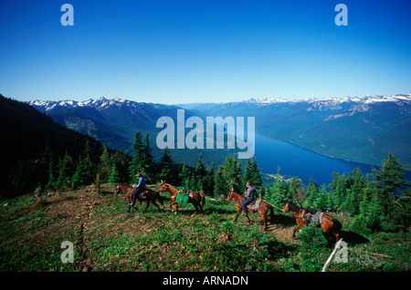 Kootenays near New Denver, Idaho Peak, horseback trail riders, Slocan Lake, British Columbia, Canada. Stock Photo