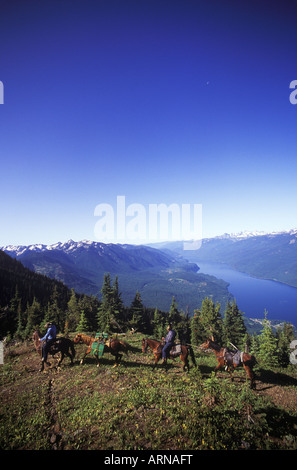 horseback trail riders, Slocan Lake, Kootenays near New Denver, Idaho Peak, British Columbia, Canada. Stock Photo