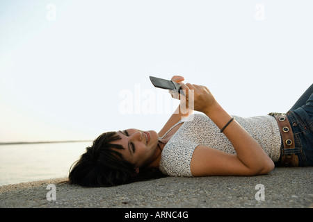 Girl looking at mobile phone Stock Photo
