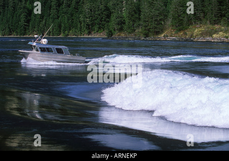 Sechelt near Egmont, flood tidal wave with boat beyond, British Columbia, Canada. Stock Photo