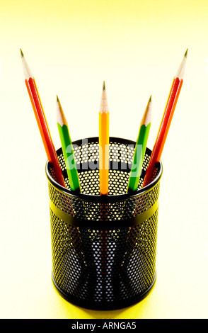 Pencils in pencil holder, symmetrically arranged Stock Photo