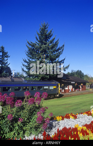 Qualicum Beach, E & N railway station with train arriving, Vancouver Island, British Columbia, Canada. Stock Photo