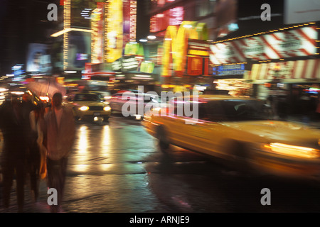 New York City Midtown Manhattan Broadway and Times Square Theatre District on a rainy night. Neon lights Stock Photo