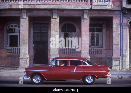Classic car in front of old buildings on the Malecon at the edge of Barrio Chino, Havana, Cuba. Stock Photo