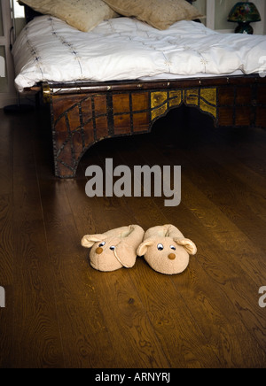 Slippers on bedroom floor Stock Photo