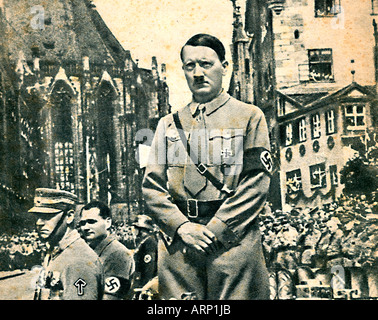 Hitler, Nuremburg, 1938 photo of the Fuhrer being driven through the streets at a Nazi rally in the Bavarian city Stock Photo