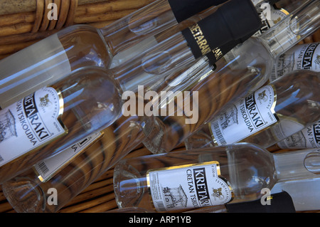 Random pile of the clear wine based liquor bottles of Cretan Kretaraki Tsikoudia Stock Photo