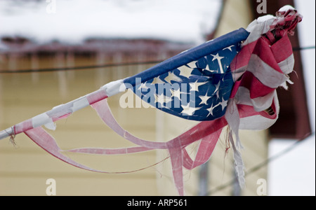 Grand Rapids Michigan A tattered American flag hangs on a house in Grand Rapids Stock Photo