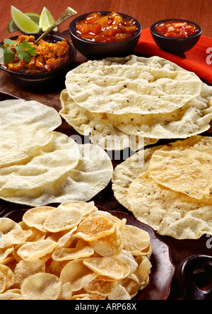 Mixed puppodums with mixed Indian dips. Stock Photo