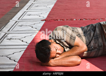 Man sleeping in Jama Masjid Mosque, Old Delhi India Stock Photo