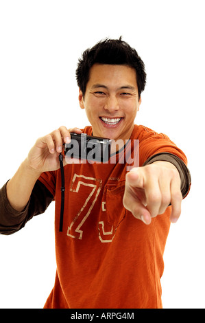 Young Man Holding Camera and Pointing Stock Photo