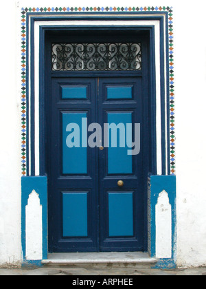 Charming blue door in Asilah in Morocco Stock Photo