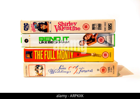 A collection of VHS videos of popular British films of the eighties and nineties. Shirley Valentine (1989) Directed by Lewis Gilbert. With Pauline Collins, Tom Conti, Julia McKenzie., Bend it Like Beckham (2002) Directed by Gurinder Chadha. With Parminder Nagra, Keira Knightley, Jonathan Rhys Meyers., The Full Monty (1997) Directed by Peter Cattaneo. With Robert Carlyle, Mark Addy, William Snape, Four Weddings and a Funeral (1994) directed buy Mike Newell, with Hugh Grant,James Fleet,Simon Callow,John Hannah,Kristin Scott Thomas,David Bower,Charlotte Coleman,Andie MacDowell. Stock Photo