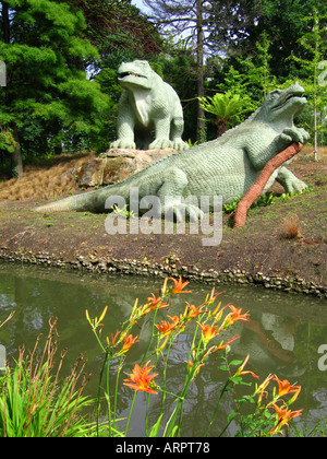Iguanodon dinosaur models at Crystal Palace Park. The first dinosaur sculptures in the world. Extensively restored in 2002, and Grade 1 Listed. Stock Photo