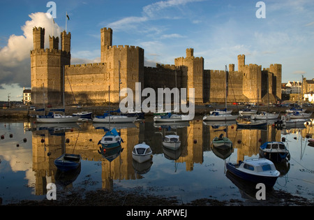 Sunset over Caernarfon Castle Caernarfon Gwynedd North Wales Stock Photo