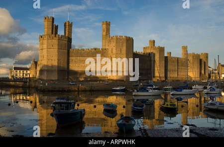 Sunset over Caernarfon Castle Caernarfon Gwynedd North Wales Stock Photo