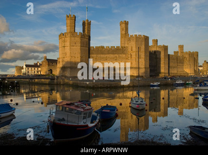 Sunset over Caernarfon Castle Caernarfon Gwynedd North Wales Stock Photo