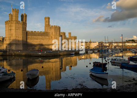 Sunset over Caernarfon Castle Caernarfon Gwynedd North Wales Stock Photo