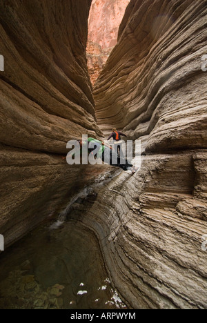 Having fun while hiking Matkatamiba Canyon a side canyon on the Colorado River in the Grand Canyon National Park Arizona Stock Photo